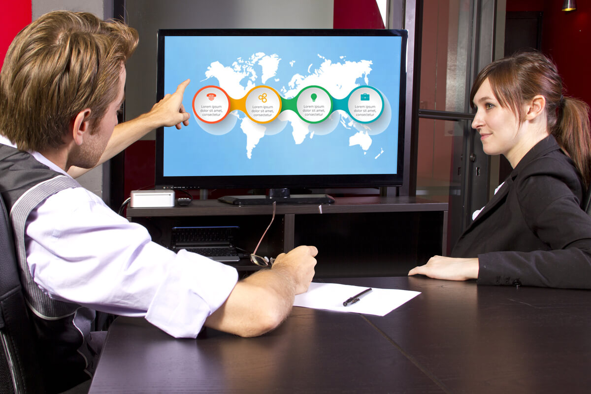 Man and woman watching presentation